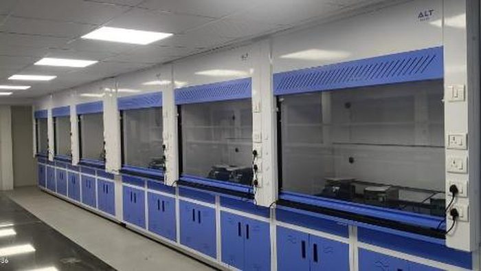 Row of ducted laboratory fume hoods